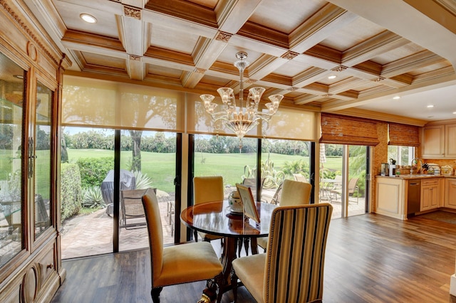 dining room featuring coffered ceiling, crown molding, dark wood finished floors, and a notable chandelier