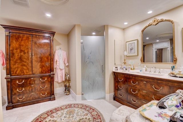 full bath featuring recessed lighting, visible vents, vanity, and baseboards