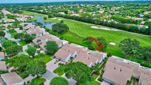 aerial view featuring a water view, a residential view, and golf course view