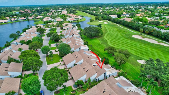 birds eye view of property featuring a residential view, a water view, and golf course view