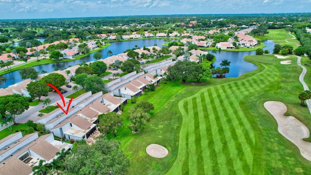 aerial view featuring a residential view, view of golf course, and a water view