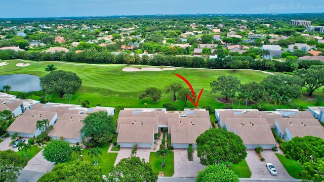 birds eye view of property featuring view of golf course and a residential view