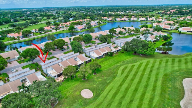 aerial view featuring a water view, view of golf course, and a residential view