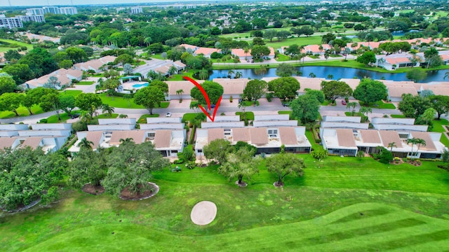 drone / aerial view featuring a residential view and a water view