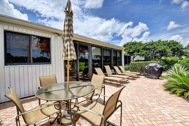 view of patio with outdoor dining area and area for grilling