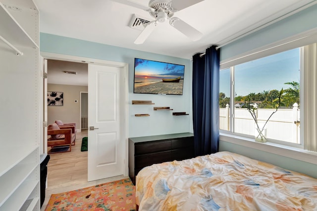 bedroom featuring light wood-style floors and ceiling fan