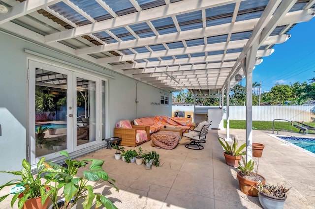 view of patio with a fenced in pool, french doors, and fence