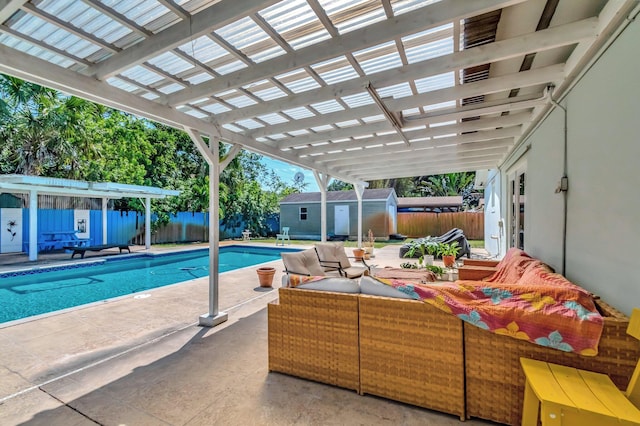 view of swimming pool featuring a fenced in pool, a patio area, a fenced backyard, and an outdoor structure