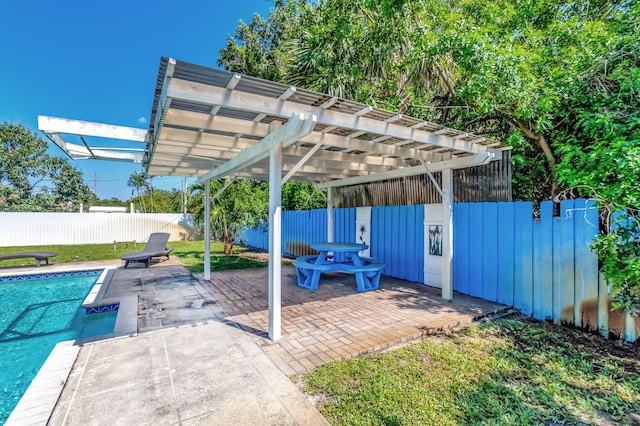 view of vehicle parking featuring a fenced backyard and a fenced in pool