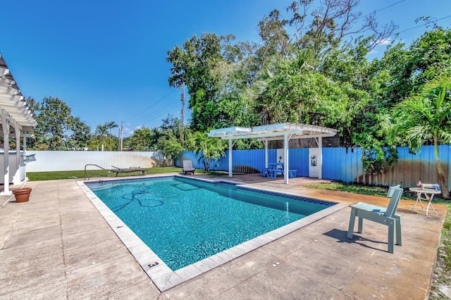 view of swimming pool featuring a fenced in pool, a patio area, a fenced backyard, and a pergola