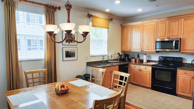 kitchen featuring a chandelier, ornamental molding, recessed lighting, black appliances, and a sink