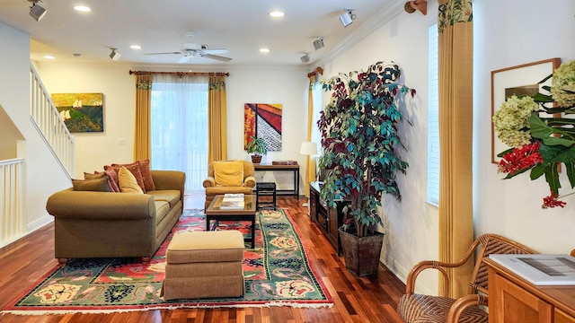 living area with ceiling fan, wood finished floors, and ornamental molding