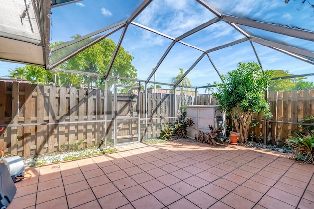 view of patio / terrace featuring a lanai and a fenced backyard