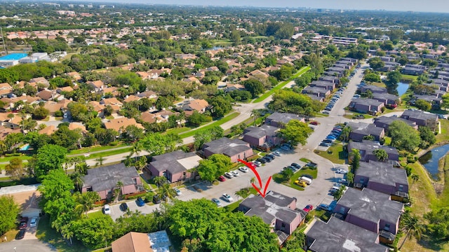 birds eye view of property with a residential view