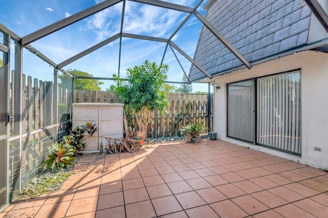 view of patio featuring a lanai and a fenced backyard