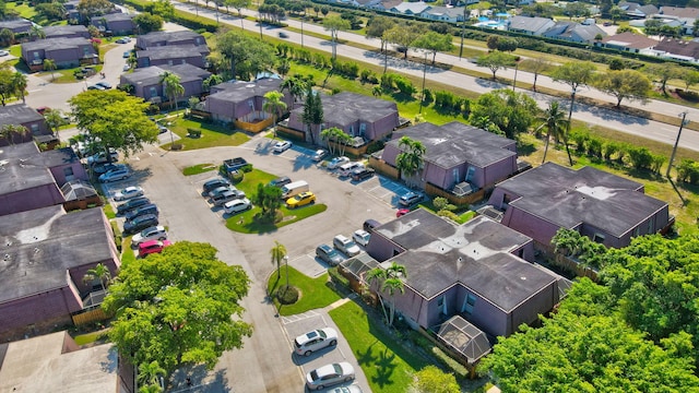 birds eye view of property with a residential view