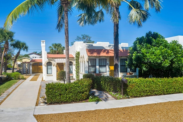 view of front of house with concrete driveway and stucco siding