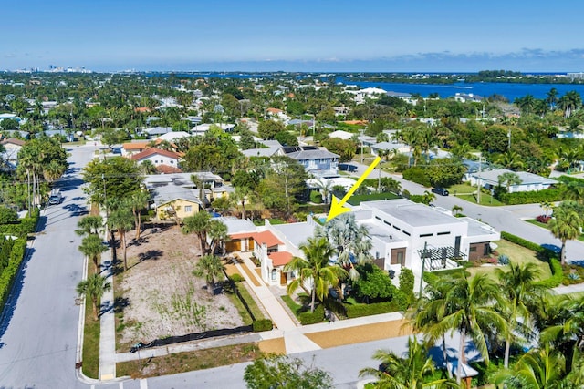 bird's eye view with a residential view and a water view