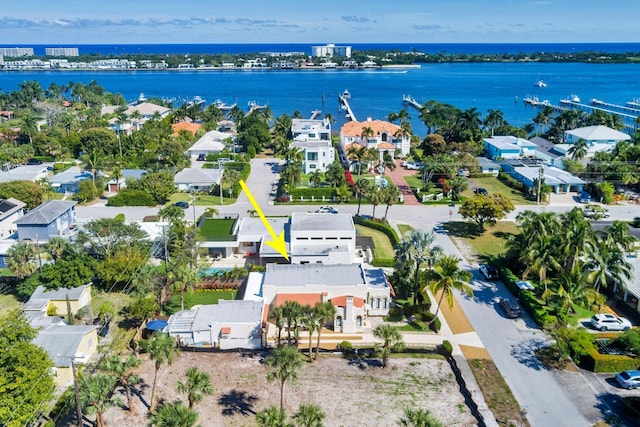 birds eye view of property with a residential view and a water view