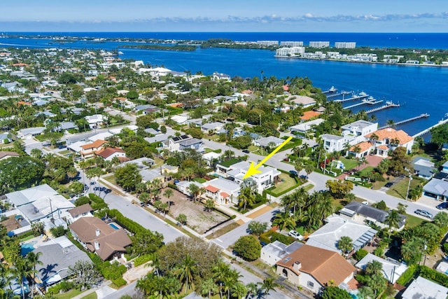 birds eye view of property featuring a water view and a residential view