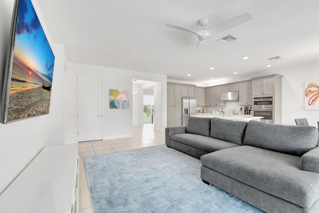 living area with recessed lighting, light tile patterned floors, a ceiling fan, and visible vents