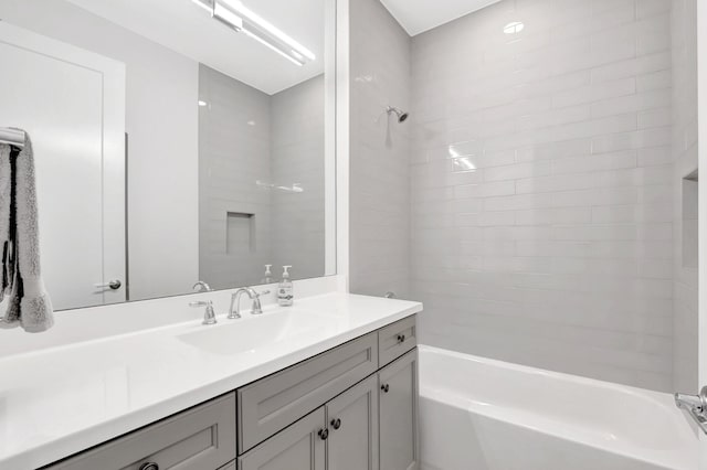 full bathroom featuring vanity and  shower combination