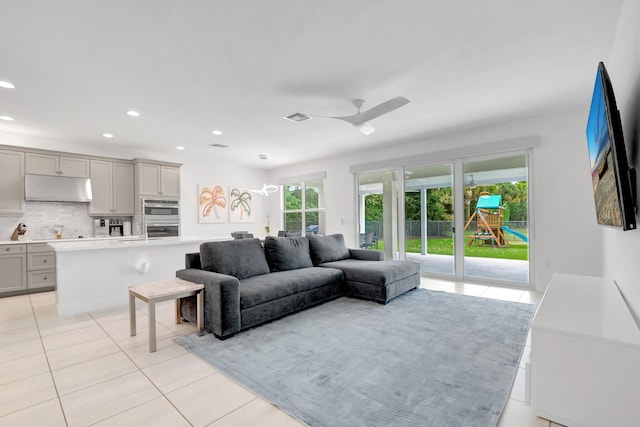 living area featuring a ceiling fan, light tile patterned flooring, recessed lighting, and visible vents