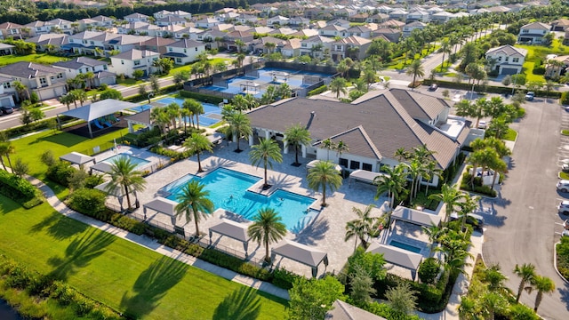 birds eye view of property with a residential view