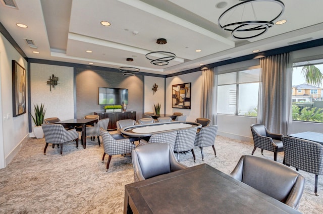 dining space with recessed lighting, a tray ceiling, baseboards, and visible vents