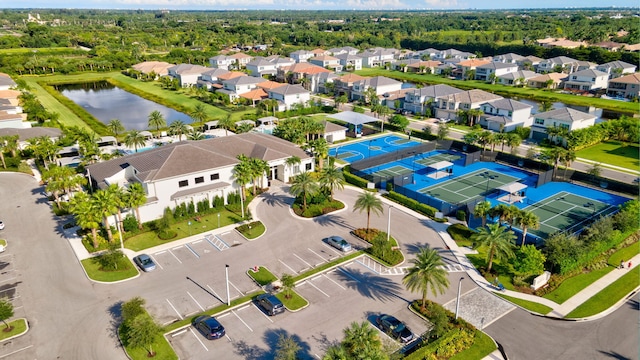 bird's eye view featuring a water view and a residential view