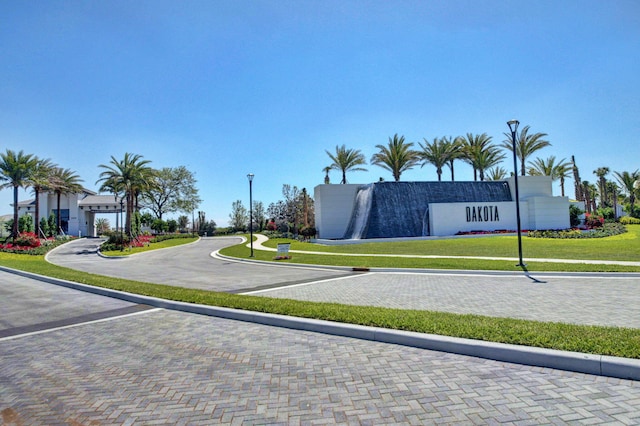 view of road with curbs and street lights