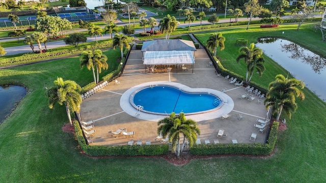 view of pool with a water view