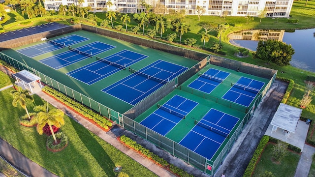 birds eye view of property with a water view