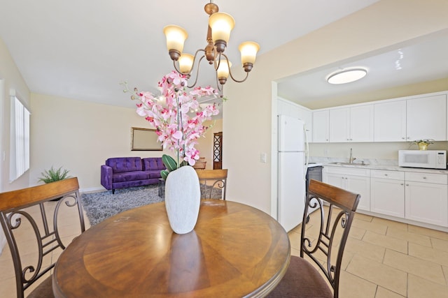 dining space with a notable chandelier and light tile patterned flooring