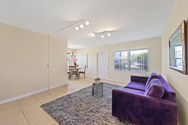 tiled living room featuring baseboards