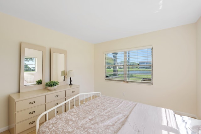 bedroom with multiple windows