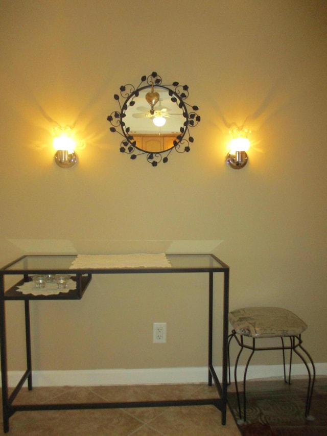 interior space featuring tile patterned flooring and baseboards