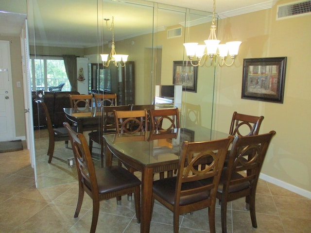 dining room with crown molding, visible vents, and a notable chandelier