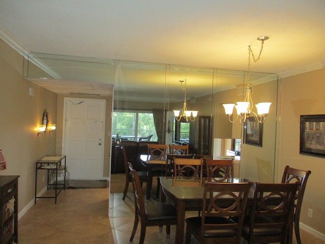 dining area featuring baseboards, ornamental molding, a notable chandelier, and light tile patterned flooring