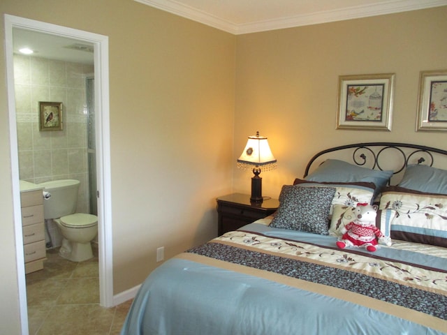 tiled bedroom with tile walls, baseboards, ornamental molding, and connected bathroom