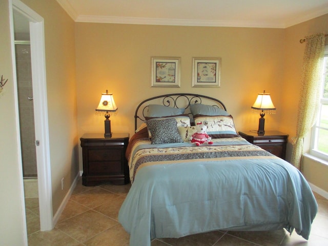 bedroom featuring baseboards, tile patterned floors, and crown molding