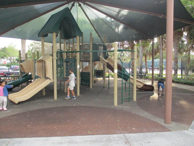 communal playground featuring fence