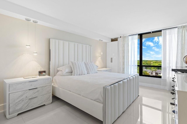 bedroom featuring light tile patterned floors