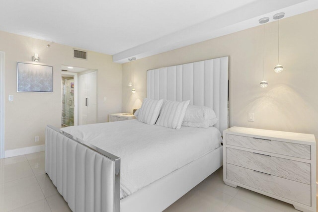 bedroom featuring baseboards, visible vents, and light tile patterned flooring