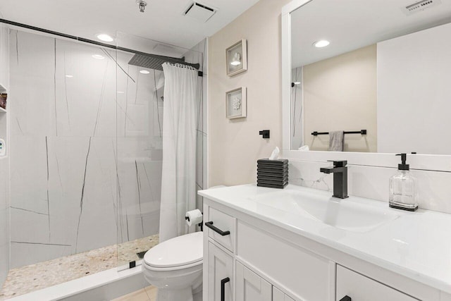 bathroom with a stall shower, visible vents, and toilet