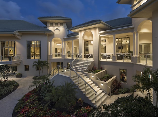 property entrance with a patio and stucco siding