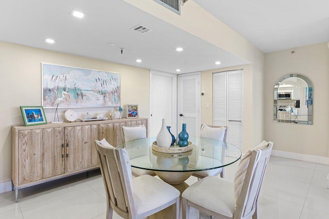 dining room featuring baseboards, light tile patterned flooring, visible vents, and recessed lighting