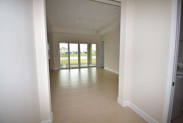 spare room with recessed lighting, light tile patterned flooring, and baseboards