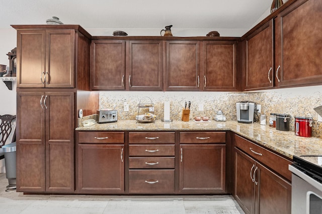 kitchen with tasteful backsplash and light stone countertops