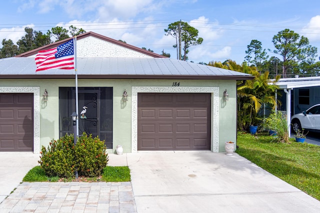 exterior space with concrete driveway